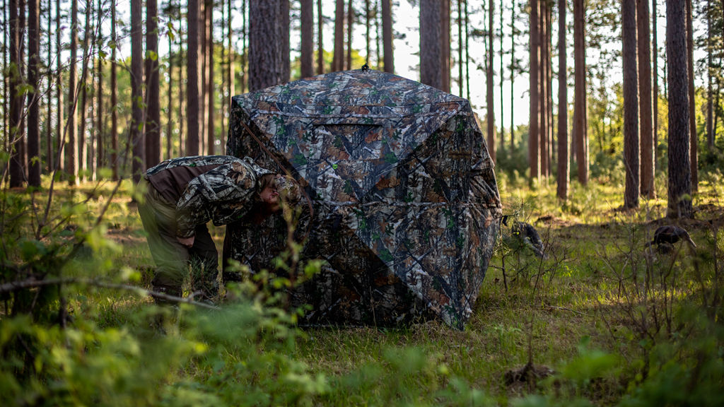 a hunter is preparing his blinds