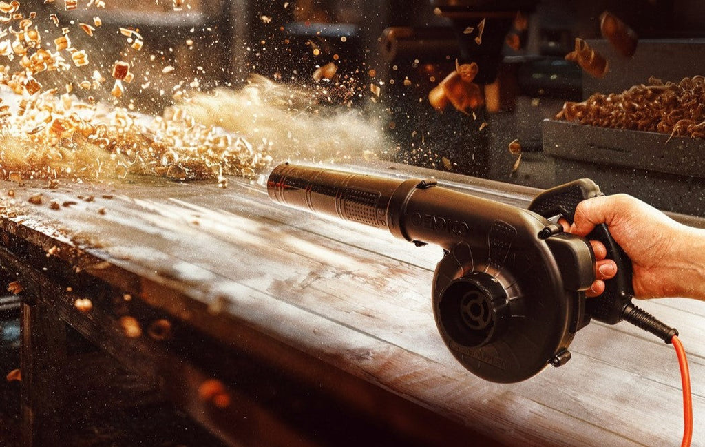 a-person-using-a-grinder-on-a-wooden-table