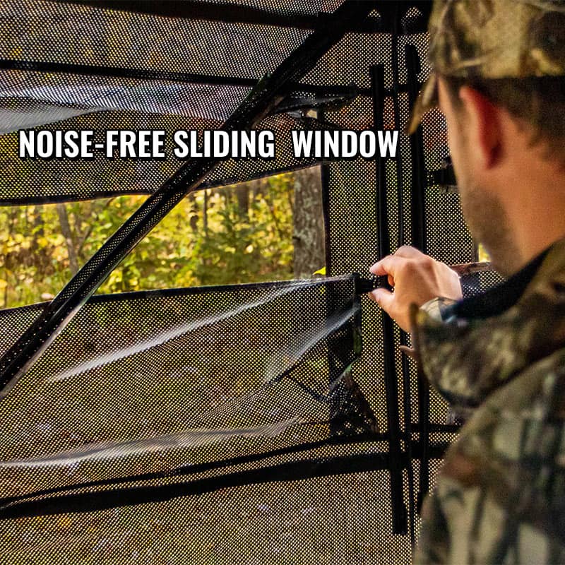 Man assembling the Occult See Through Hunting Blind 2-3 Person Pop Up Ground Deer Blind, showcasing its one-way see-through panels and sliding windows for unobstructed views.