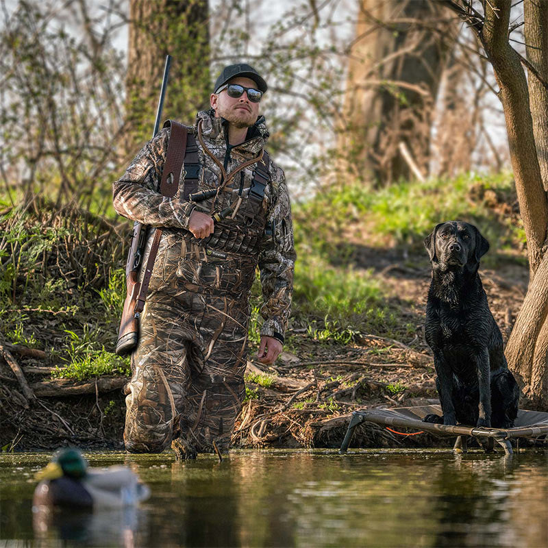 a hunter with TideWe wader stands in the water