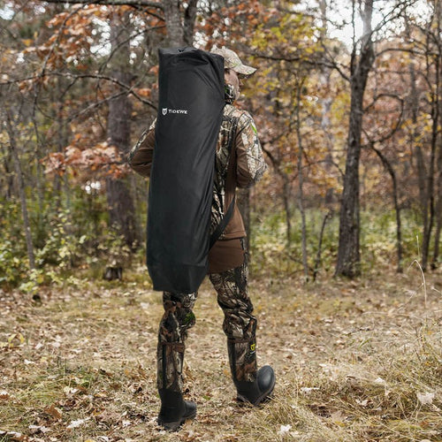 A man with the blind on his back walking.